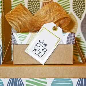 A neatly wrapped gift box with decorative ribbon and 'Just For You' tag, perfect for celebrations.